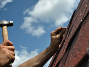 Local roof repair pro fixing a roof in Humble, TX