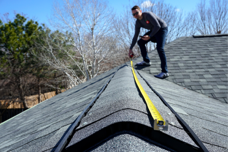 Professional Humble roofing inspector measuring a roof | free estimates
